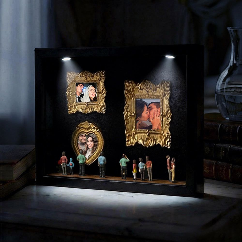 Miniature personalized museum gift in black frame with spotlights, featuring a cute couple scene, by MadeMine.